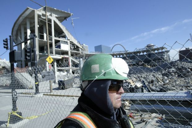 Construction worker near ruins of Busch Stadium